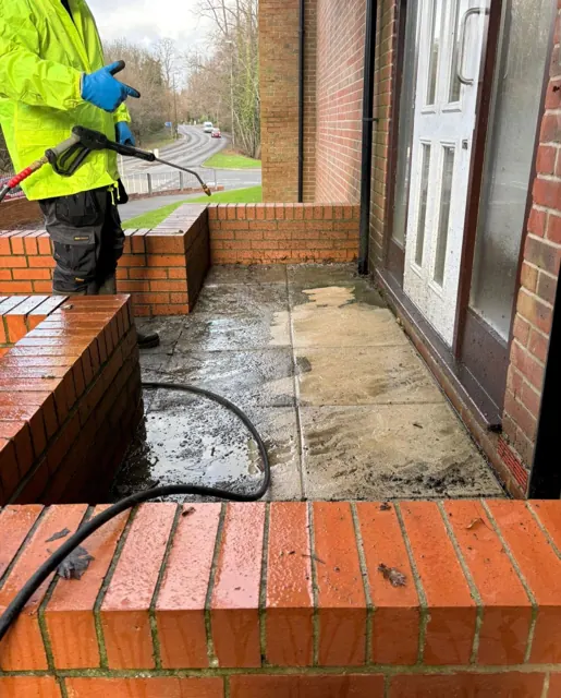 Pressure washing an entrance